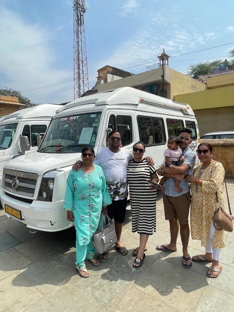 Happy clients exploring Agra Taj Mahal monuments on an outstation luxury traveller ride